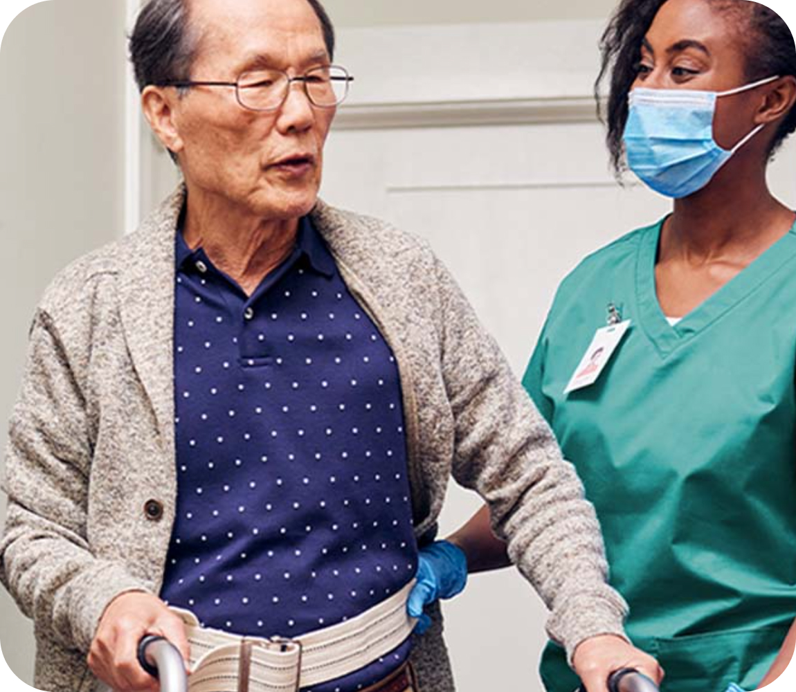 Healthcare professional helping a patient